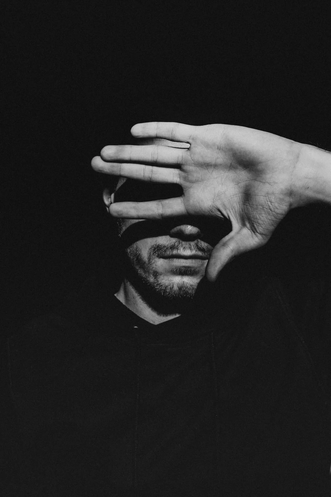 A man with a beard covering one eye