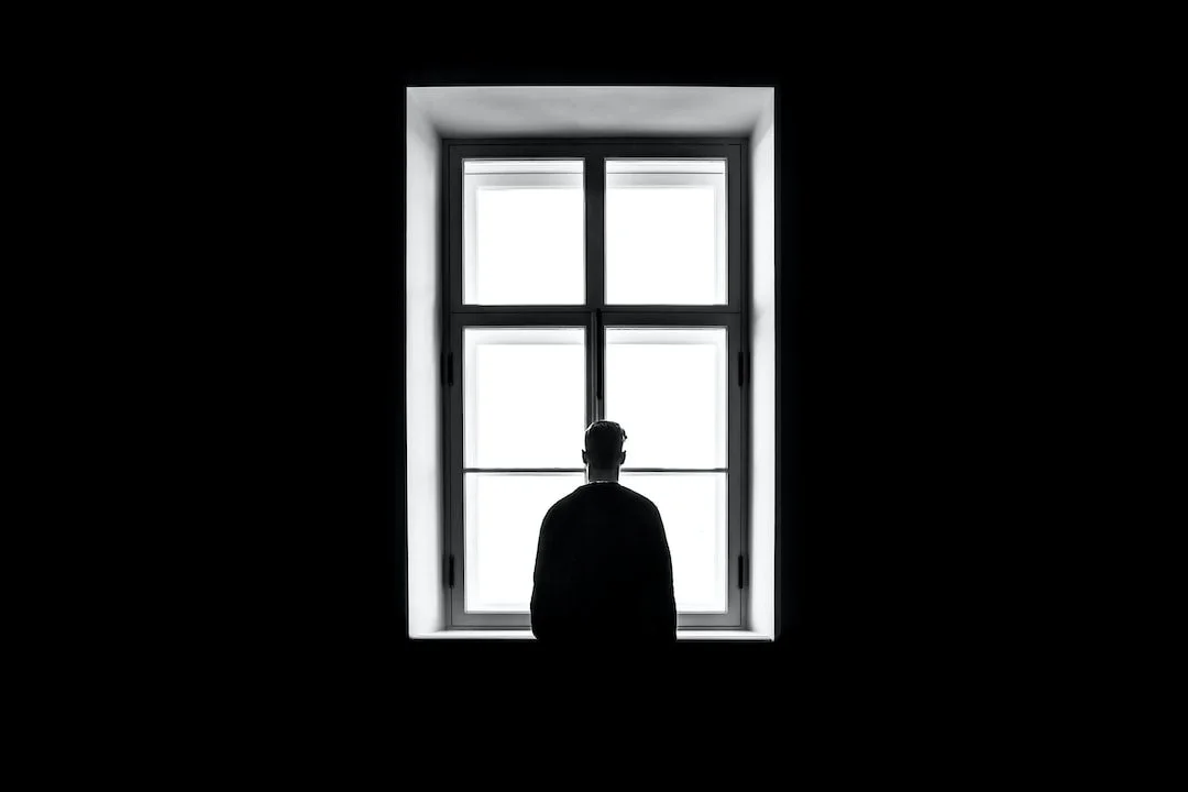 A person sitting at a window